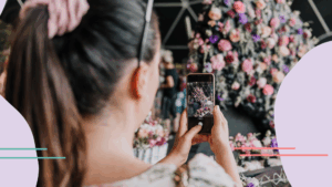 Blog 5 woman taking pictures of floral display